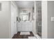 Bright bathroom featuring wood look floors, shaker cabinets, and a glass enclosed shower at 2536 Maricopa Blvd, Whitestown, IN 46075