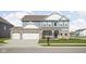 Charming two-story home featuring a landscaped front yard, porch, and a two-car attached garage at 2536 Maricopa Blvd, Whitestown, IN 46075