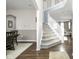 A staircase leads from the foyer to the second floor with an adjacent dining area to the left at 2536 Maricopa Blvd, Whitestown, IN 46075