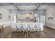 A modern kitchen showcases an island with seating and updated stainless appliances at 2536 Maricopa Blvd, Whitestown, IN 46075
