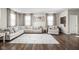 Inviting living room showcasing a large sectional sofa, hardwood floors, and stylish decor and natural light at 2536 Maricopa Blvd, Whitestown, IN 46075
