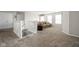 Cozy loft area with plush carpeting, neutral tones, and ample seating for relaxing or entertaining guests at 2536 Maricopa Blvd, Whitestown, IN 46075