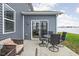 Cozy outdoor patio with a dining area and lounge seating, perfect for enjoying the fresh air and outdoor gatherings at 2536 Maricopa Blvd, Whitestown, IN 46075