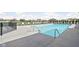 Community pool featuring inviting lounge chairs and a secure gated perimeter at 2536 Maricopa Blvd, Whitestown, IN 46075