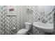Stylish powder room with patterned wallpaper, modern sink, and decorative turtle art at 2536 Maricopa Blvd, Whitestown, IN 46075
