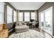 A bright sitting room with a comfortable chaise lounge, work desk, and lots of natural light at 2536 Maricopa Blvd, Whitestown, IN 46075