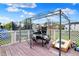 Back deck area with table, grill and seating, perfect for outdoor entertaining at 3110 S Temple Ave, Indianapolis, IN 46237