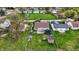 Aerial view of a fenced backyard with a trampoline, storage shed, deck, and a well-maintained green lawn at 3110 S Temple Ave, Indianapolis, IN 46237
