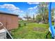 View of backyard featuring storage shed and partially visible trampoline, offering space for storage and recreation at 3110 S Temple Ave, Indianapolis, IN 46237