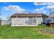 Backyard with a white lattice deck and a glimpse of a trampoline, great for Gathering fun and relaxation at 3110 S Temple Ave, Indianapolis, IN 46237