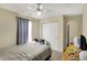 This bedroom features a ceiling fan and built in sliding closet at 3110 S Temple Ave, Indianapolis, IN 46237