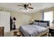 Comfortable bedroom with ceiling fan and a large window at 3110 S Temple Ave, Indianapolis, IN 46237