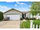 Charming single-story home featuring a well-maintained front yard, attached garage, and a cozy entrance at 3110 S Temple Ave, Indianapolis, IN 46237