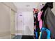 Hallway view featuring an open doorway, an entry closet and neutral walls at 3110 S Temple Ave, Indianapolis, IN 46237
