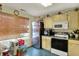 Cozy kitchen featuring light-colored cabinets and a window letting in natural light at 3110 S Temple Ave, Indianapolis, IN 46237