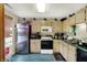 Functional kitchen featuring stainless steel appliances and ample storage at 3110 S Temple Ave, Indianapolis, IN 46237