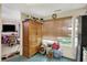 Kitchen view of tan cabinets and large window at 3110 S Temple Ave, Indianapolis, IN 46237