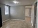 Kitchen area featuring tile flooring, window, and view to hallway at 3302 S Rybolt Ave, Indianapolis, IN 46221