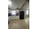Spacious kitchen with updated appliances, tiled floor, and window at 3302 S Rybolt Ave, Indianapolis, IN 46221