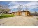 Charming single-story home with a well-manicured lawn and attached garage at 3502 River Park Dr, Anderson, IN 46012