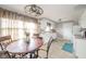 Eat-in kitchen featuring a round table, updated cabinets, and plenty of natural light from the window at 3502 River Park Dr, Anderson, IN 46012
