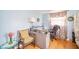 Office with blue walls, wood floors, desk, lamp, and window with natural light at 3502 River Park Dr, Anderson, IN 46012