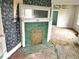 A vintage fireplace with green tile and unique details, adding character to the room at 359 W 26Th St, Indianapolis, IN 46208