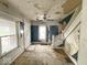 A spacious living room with hardwood floors and a staircase, ready for customization at 359 W 26Th St, Indianapolis, IN 46208