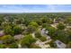 An aerial view of a home nestled in a lush, green neighborhood with tree-lined streets at 3738 Barrington Dr, Carmel, IN 46033