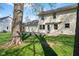Large backyard featuring a patio, lawn, and mature trees creating a serene outdoor space at 3738 Barrington Dr, Carmel, IN 46033