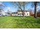 Spacious backyard with lush green grass and mature trees, offering plenty of space for outdoor activities at 3738 Barrington Dr, Carmel, IN 46033