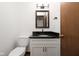 Bathroom with a modern toilet, vanity, and mirror, ensuring comfort and style at 3738 Barrington Dr, Carmel, IN 46033