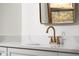Bathroom detail highlighting a modern vanity, sleek faucet, and stylish countertop finish at 3738 Barrington Dr, Carmel, IN 46033