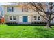 Charming home with a stone facade, a bright teal front door, and a lush green lawn at 3738 Barrington Dr, Carmel, IN 46033