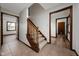 Open foyer featuring tile flooring, wood trim, a staircase, and entryways to other rooms at 3738 Barrington Dr, Carmel, IN 46033