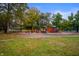 Vibrant community playground with colorful equipment surrounded by a leafy, park-like setting on a sunny day at 3738 Barrington Dr, Carmel, IN 46033