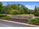Stone sign for St. Elizabeth Seton surrounded by trees along a quite road, offering serenity at 3738 Barrington Dr, Carmel, IN 46033