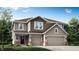 Charming two-story home features a two-car garage, landscaped yard, and inviting front entrance at 3916 Andean Ct, Bargersville, IN 46106