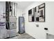 Efficient utility room equipped with a water heater, furnace, and modern wall art for added appeal at 3916 Andean Ct, Bargersville, IN 46106