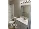This bathroom has a vanity with storage, a mirror, and shower-tub combo at 4311 Village Parkway W Cir # 6, Indianapolis, IN 46254