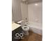 The bathroom includes a tub with shower and a tile surround at 4311 Village Parkway W Cir # 6, Indianapolis, IN 46254