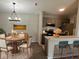 Inviting dining room open to a bright kitchen with modern countertops and cabinetry at 4311 Village Parkway W Cir # 6, Indianapolis, IN 46254
