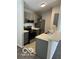 Well-equipped kitchen featuring stainless steel appliances and sleek gray cabinetry at 4311 Village Parkway W Cir # 6, Indianapolis, IN 46254