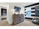 Inviting bedroom featuring a gray dresser with decor, and blue dinosaur artwork at 4390 Risen Star Way, Bargersville, IN 46106