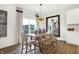Dining area with wooden table and stylish decor offers a great space for Gathering meals at 4390 Risen Star Way, Bargersville, IN 46106
