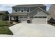 Charming two-story home with a two-car garage, manicured lawn, and neutral colored siding at 4390 Risen Star Way, Bargersville, IN 46106