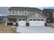 Charming two-story home featuring a spacious two-car garage, neutral siding, and a welcoming front porch at 4390 Risen Star Way, Bargersville, IN 46106