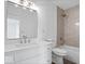 Tastefully updated bathroom featuring a white vanity, sleek lighting, and a shower-tub combination at 456 E Arch St, Indianapolis, IN 46202