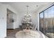 Cozy dining room featuring a round table, stylish chairs, and a sliding glass door to the outdoors at 456 E Arch St, Indianapolis, IN 46202