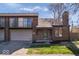Exterior view of the townhouse showcasing brick facade, garage, and inviting curb appeal at 456 E Arch St, Indianapolis, IN 46202